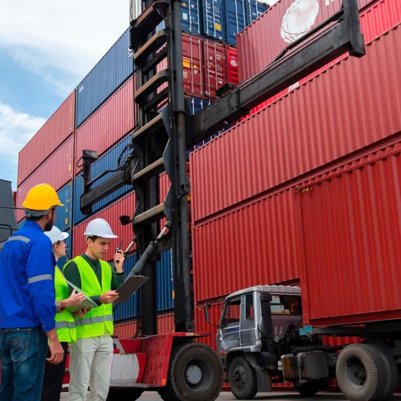 foreman-engineer-man-control-loading-containers-box-from-cargo-freight-ship-for-import-export.jpg
