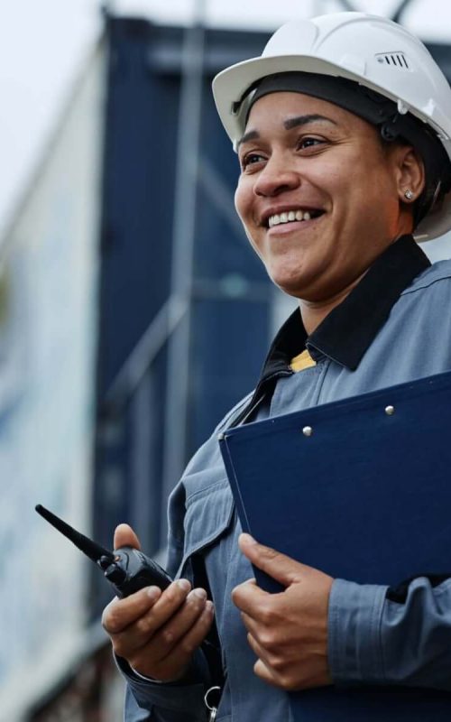 woman-working-at-shipping-docks-with-containers.jpg