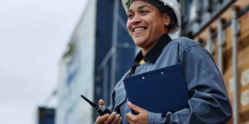 woman-working-at-shipping-docks-with-containers.jpg