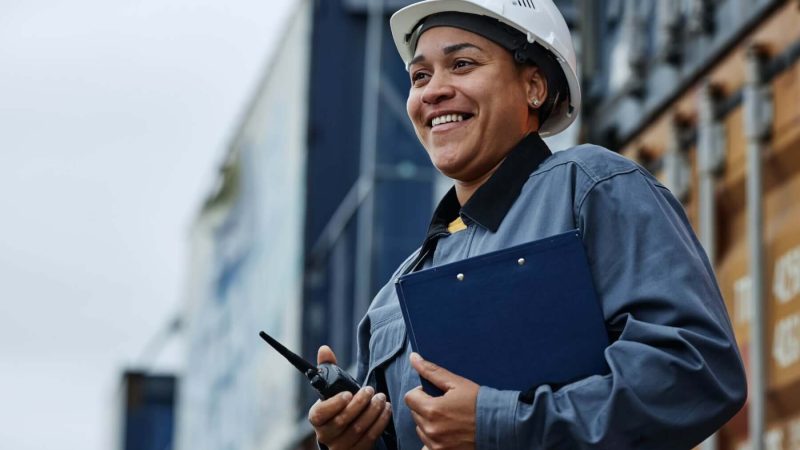 woman-working-at-shipping-docks-with-containers.jpg